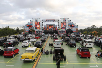 People watch a drive-in music concert as activities return for the benefit of domestic tourists in Bali, Indonesia.
