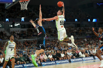 Mitch Creek throws down a dunk against Melbourne United.