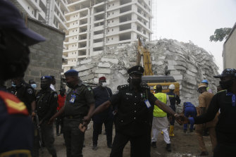 Rescue workers have been spotted at the site of a collapsed 21-storey apartment building under construction in Lagos, Nigeria, Tuesday AEDT.
