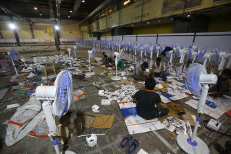 Laborers working to set up at COVID-19 field hospital in Mumbai.