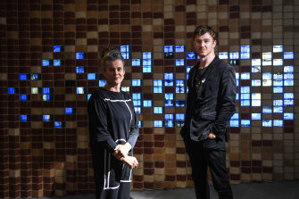 Rose Hiscock, of the University of Melbourne, and Ryan Jefferies, from the Science Gallery, in front of the “digital bricks” at the entrance to the new museum.