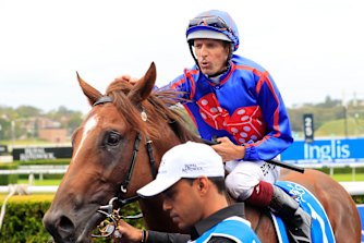 Hugh Bowman gives Profiteer a pat after winning the Inglis Millennium. He is favourite to repeat the success in the Golden Slipper on Saturday.