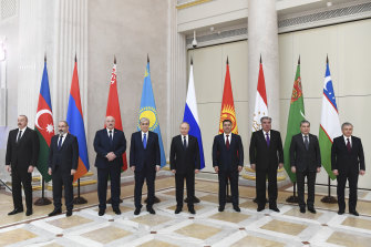 Leaders of ex-Soviet nations members of the Commonwealth of Independent States, from left, Azerbaijan’s Ilham Aliev, Armenia’s Nikol Pashinyan, Belarus’ Alexander Lukashenko, Kazakhstan’s Kassym-Jomart Tokayev, Russia’s Vladimir Putin, Kyrgyzstan’s Sadyr Zhaparov, Tajikistan’s Emomali Rakhmon, Turkmenistan’s Gurbanguli Berdymukhamedov, and Uzbekistan’s Shavkat Mirziyoyev, meet in Strelna, Russia, on December 28.