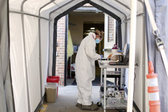 A medical worker at a coronavirus drive-through testing site in Casper, Wyoming, this month.