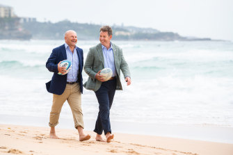 Happier times .... Former Rugby Australia CEO Rob Clarke and NZR boss Mark Robinson walking on Manly beach  in 2020.