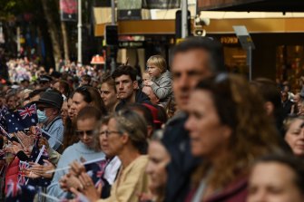 Crowds line Elizabeth Street in Sydney’s CBD to watch the Anzac Day march.