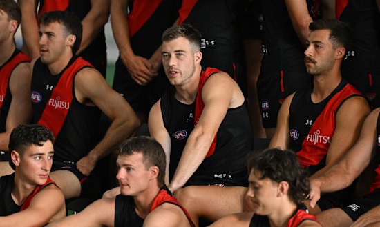 Essendon skipper Zach Merrett (middle) is cautiously optimistic about the season ahead.