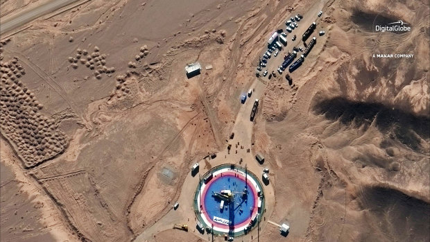 A satellite image shows a missile on a launch pad and activity at the Imam Khomeini Space Centre in Iran's Semnan province on Tuesday.