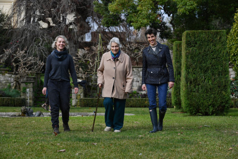 Head gardener Anna Thompson and Myer family members Lady Marigold Southey and Lindy Shelmerdine in the Cranlana garden.
