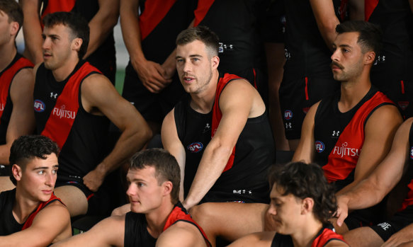 Essendon skipper Zach Merrett (middle) is cautiously optimistic about the season ahead.