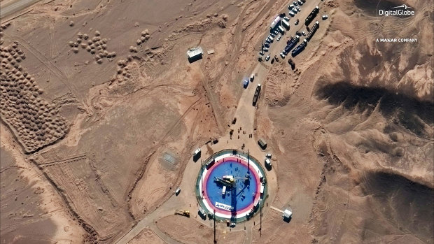A satellite image shows a missile on a launch pad and activity at the Imam Khomeini Space Centre in Iran's Semnan province on Tuesday.