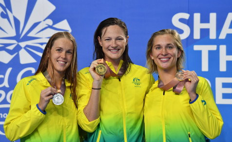 Whitewash: Australia claimed a 1-2-3 the women's 50m butterfly on Sunday night. Pictured are medallists Holly Barratt (silver), Cate Campbell (gold) and Madeline Groves (bronze). 