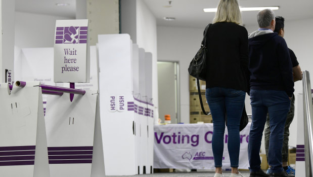 People casting their ballots at a central Sydney voting centre on the first day of prepoll voting for the federal election.