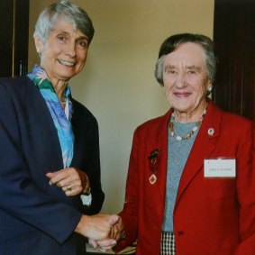 Jess Flanders receiving the Red Cross 50 years medal from Jan de Kretser, wife of former Victorian governor David de Kretser.