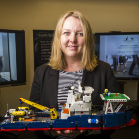 DHS national manager of cyber security Narelle Devine with a lego model used in the cyber war games last year.