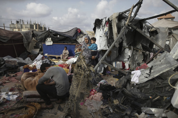 The remnants ofatent city in Rafah set alight by an Israeli airstrike, burning its inhabitants to death.