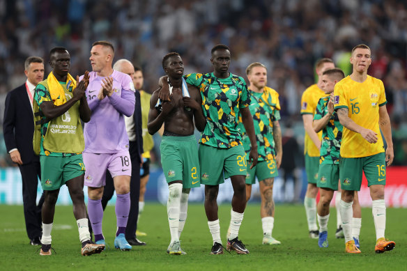 Garang Kuol and Thomas Deng, middle, feel the pain after Australia’s 2-1 loss to Argentina. 
