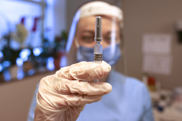 Turkish nurse Arzu Yildirim holds a vial of Sinovac's CoronaVac vaccine. The Turkish study was based on 1,322 participants, 752 of whom got a real vaccine and 570 of whom received a placebo.