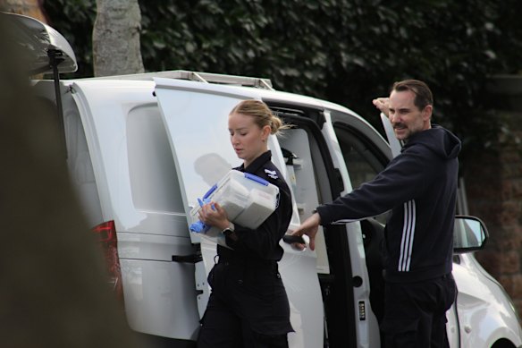 Police at the home in Clayfield on Saturday morning. 