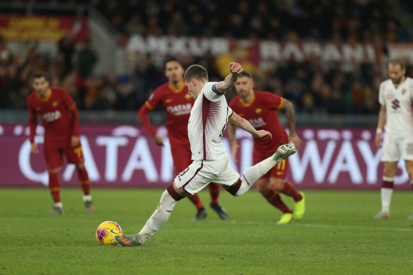 Andrea Belotti scores Torino's second goal. 