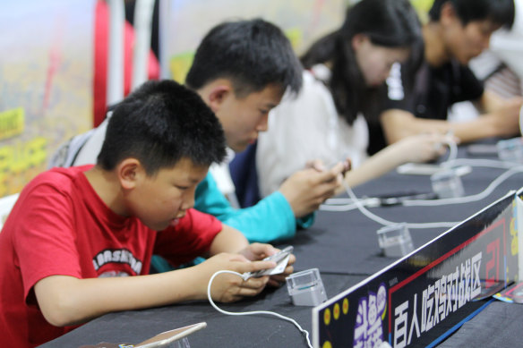 Young Chinese gamers play Tencent’s popular Honour of Kings adventure game.