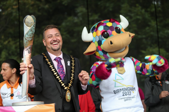 Local Councillor Richard Jones holds the Queen’s Baton with Perry, the official Birmingham 2022 mascot, during the Birmingham 2022 Queen’s Baton Relay as part of the Commonwealth Games 2022.