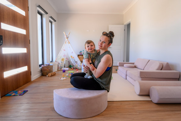 Hannah Fuller with her son Alfie in their refurbished home. 