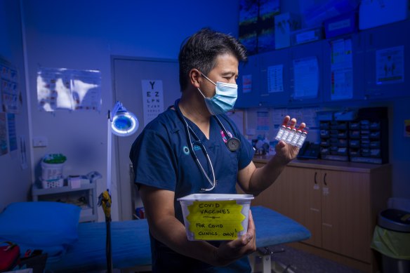 Dr Bernard Shiu prepares to deliver the AstraZeneca COVID-19 vaccine for the first time at the Banksia Medical Centre in Newcomb.