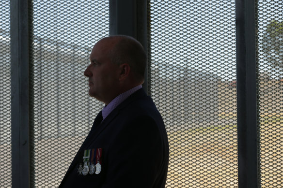 Then-Corrections Minister David Elliott attends a prison opening in 2018.