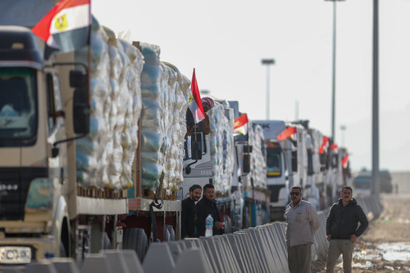 Aid trucks wait at the Rafah crossing to go into Gaza.