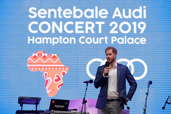 Prince Harry speaking on stage during a concert hosted by his charity Sentebale in 2019.