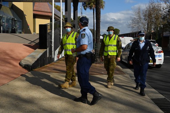 Police and the Australian Defence Force patrol the streets of Bankstown, one of the LGAs with strict restrictions allowing only healthcare and emergency service essential workers to leave the area during the lockdown. 