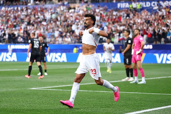 Ramin Rezaeian celebrates scoring.