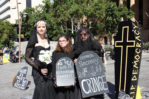 Tight Knit organiser Tully Connor and members of the group, which is close with several opposition councillors, protest outside City Hall on Tuesday over recent changes to what information councillors are allowed to access. 