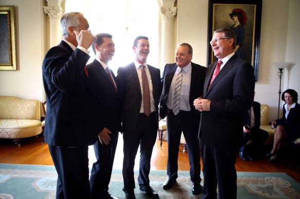 Tim Bull, second from right, pictured here at a swearing in ceremony in 2014, claimed credit for the reforms to the Aboriginal cultural heritage management laws in 2016.