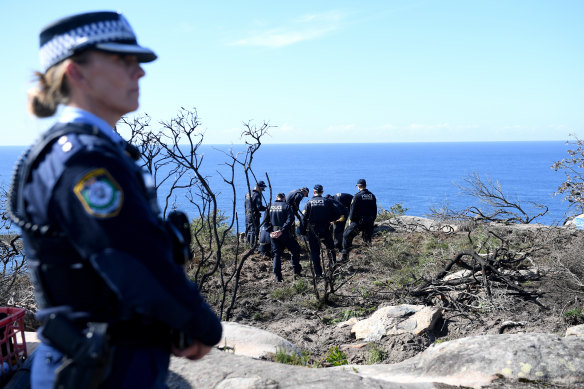Police undertake a search at North Head near Manly on Tuesday.