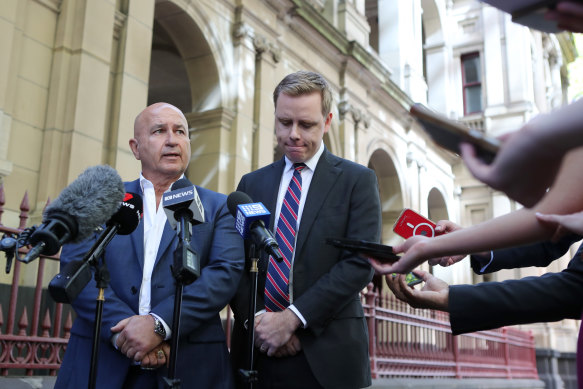 Nick Andrianakis and Michael Donelly speak outside the Supreme Court of Victoria on Monday.