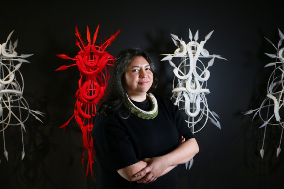 Artist Grace Lillian Lee of Meriam Mir with part of her series ‘Belonging’ in the Yiribana Gallery being unveiled at the opening of Sydney Modern from December 3.