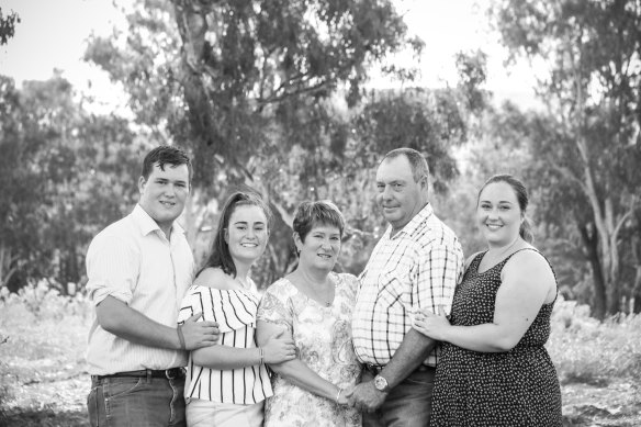 Adam, with his sister Amanda (left), mother Philippa, father Peter and sister Emma (right)