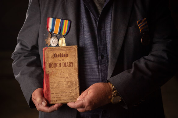 Malcolm Milliken holds his uncle Morris Milliken’s World War I diary. 