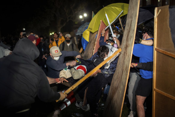 Duelling groups of protesters clashing at the University of California in Los Angeles.