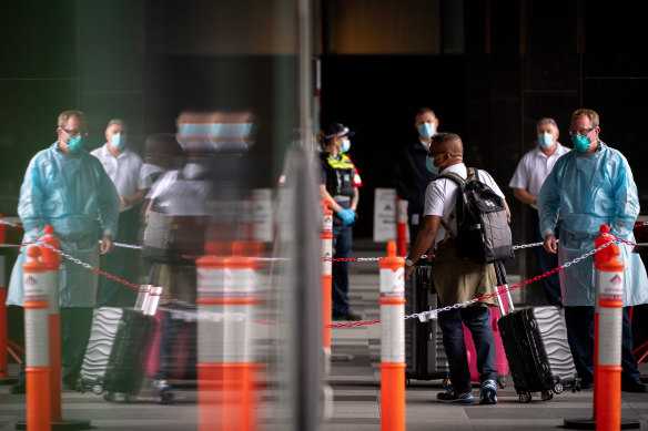 International travellers arrive at the Pan Pacific Hotel on Monday.