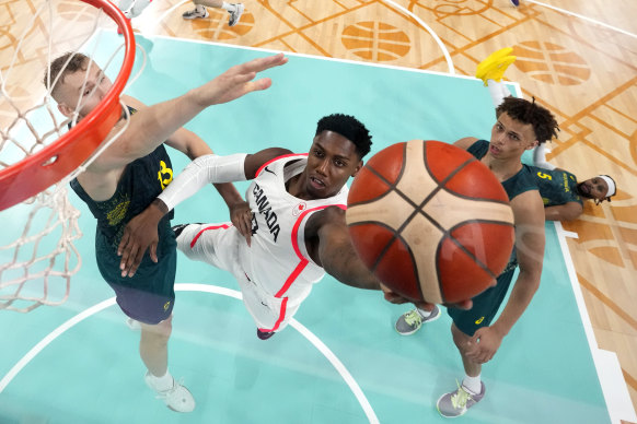 RJ Barrett up against Jock Landale (left) and Dyson Daniels.
