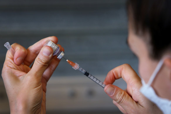 A nurse prepares the Pfizer vaccine. 