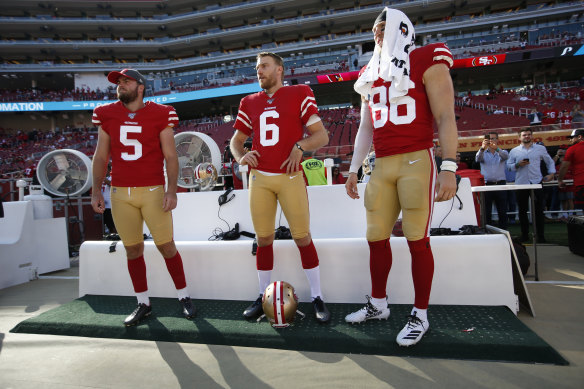 Mitch Wishnowsky (centre) has taken an unorthodox road from Perth glazier to the Super Bowl. 