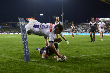 Storm winger Will Warbrick dives over for one of his four tries on Saturday night.