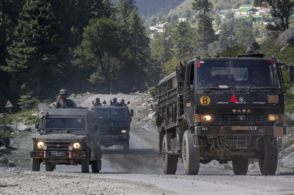An Indian army convoy moves on the Srinagar-Ladakh highway on Wednesday.