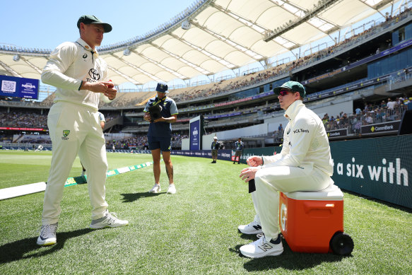Marnus Labuschagne and Steve Smith look on. 