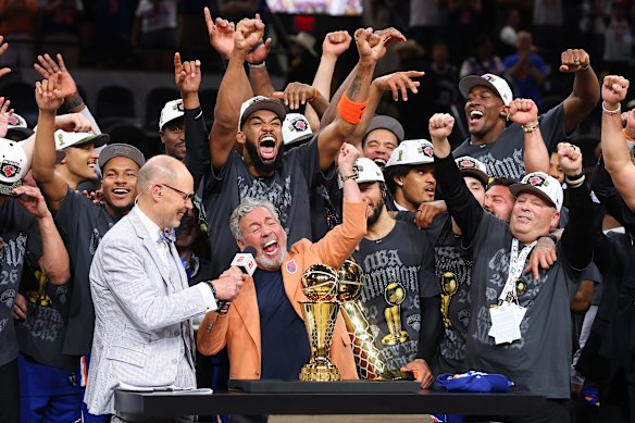 New York Knick owner James Dolan in the centre of the celebrations.