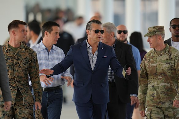 Pete Hegseth (centre) has rejected reports of unsafe conditions for the USS Abraham Lincoln’s crew.